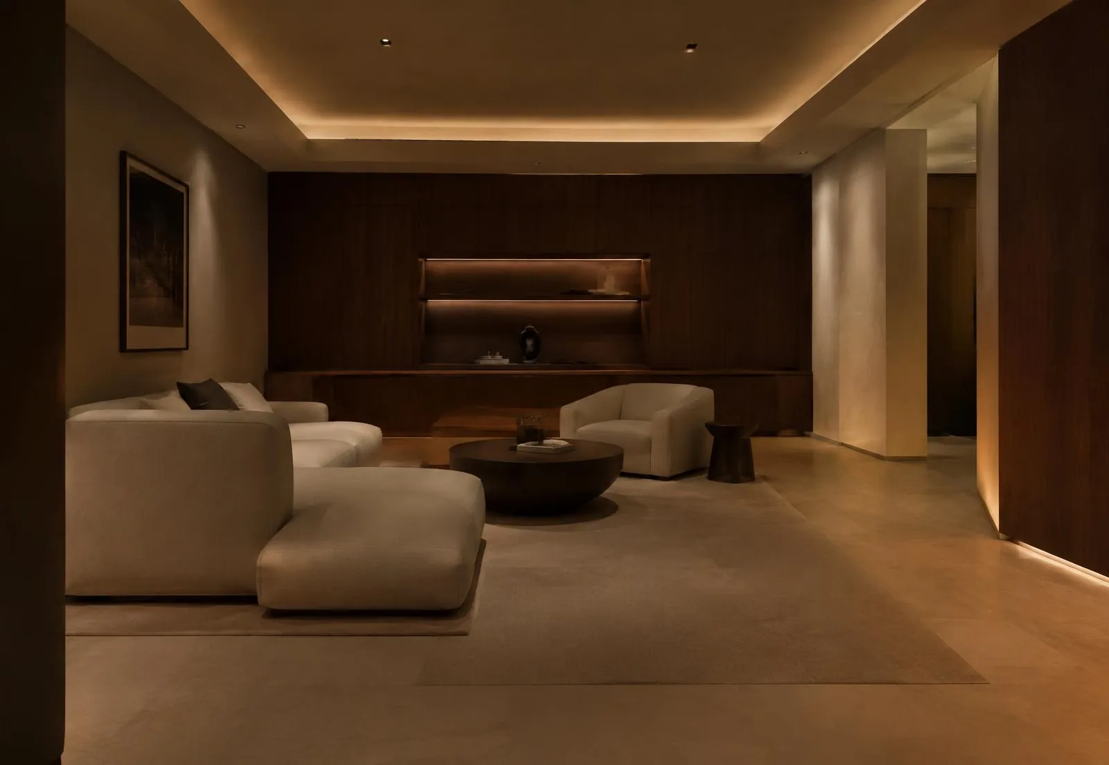 Concept inspiration: Warmly lit lower-level lounge with walnut millwork